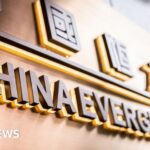 Evergrande: Shares in crisis-hit property giant jump in market return